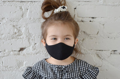 Little kid wearing Black Mask and Pearl Bobble in hair